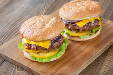 Melted cheese and crisp bacon meet golden buns in a hearty rustic presentation