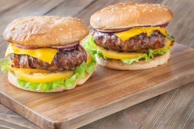 Melted cheese and crisp bacon meet golden buns in a hearty rustic presentation