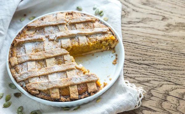 Pumpkin pie on the wooden background — Stock Photo, Image