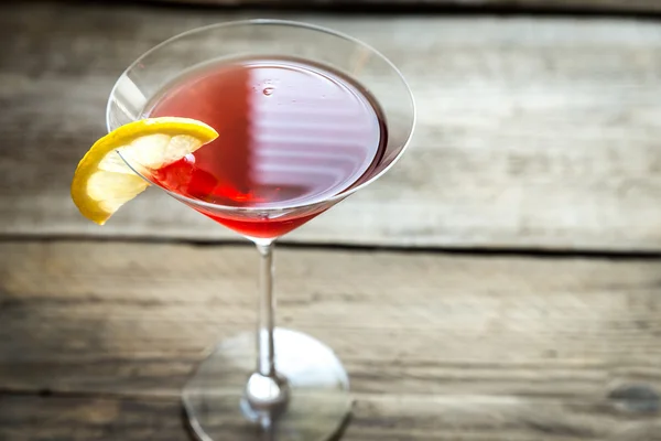 Cosmopolitan cocktail on the wooden background — Stock Photo, Image
