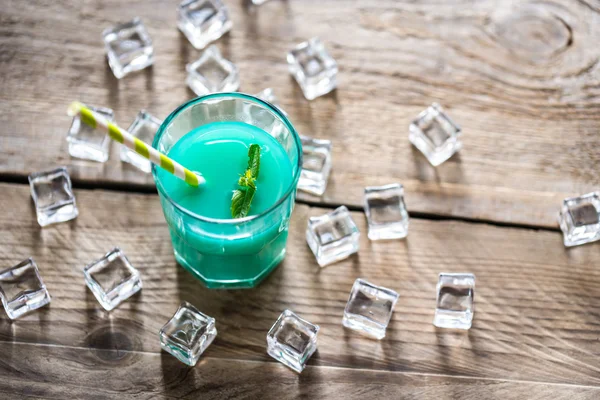 Glass of blue curacao and juice cocktail — Stock Photo, Image