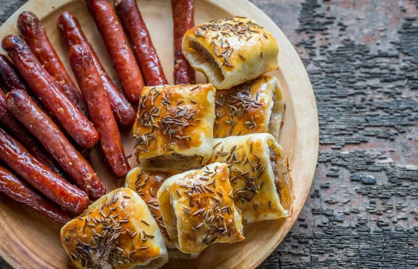 Grilled sausages and sausage rolls — Stock Photo, Image