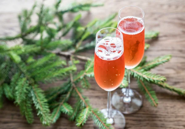 Two glasses of champagne with Christmas tree branch — Stock Photo, Image