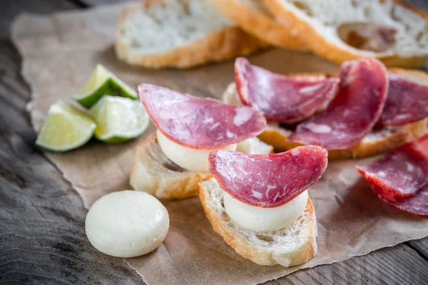 Ciabatta sandwiches with fuet and mini cheese — Stock Photo, Image