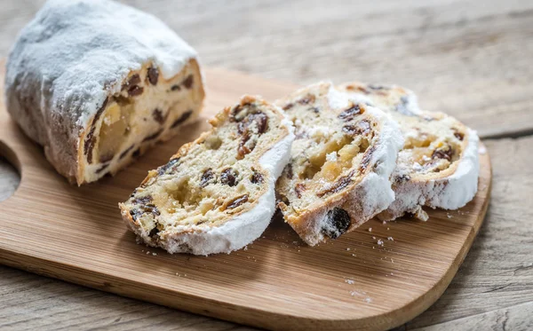 Stollen cake on the wooden board — Stock Photo, Image