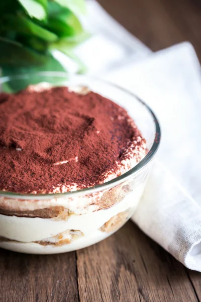 Tiramisu in the glass bowl on the wooden background — Stock Photo, Image