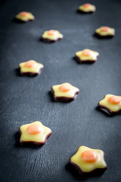 Fondant candies on the wooden background — Stock Photo, Image