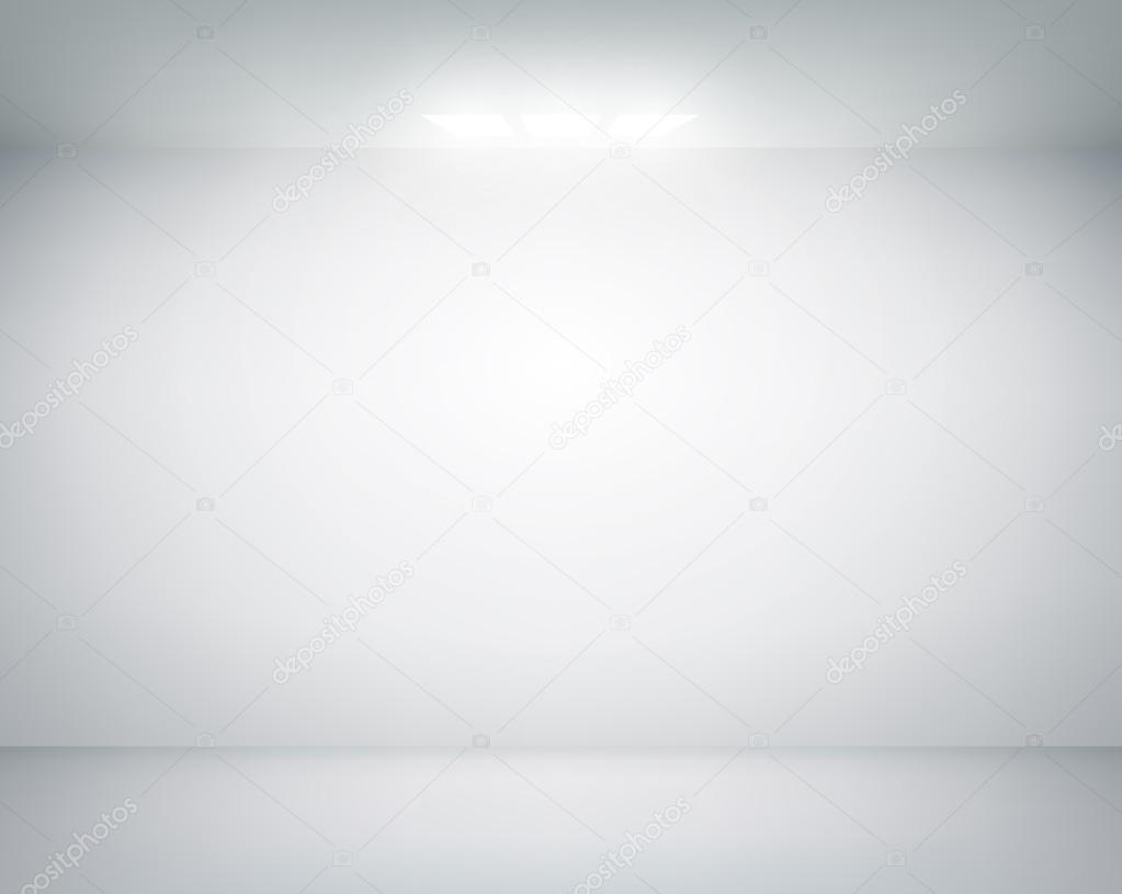 white wall on which shines a flashlight