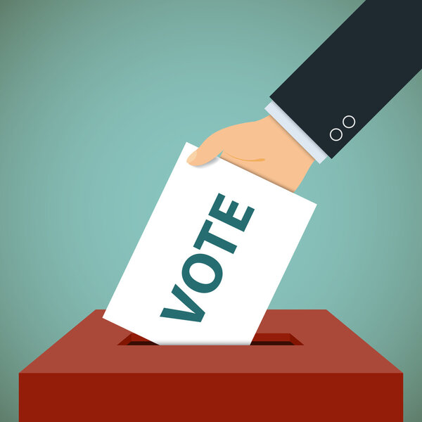 Человеческая рука с избирательным бюллетенем
.