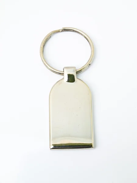 Metalik biblo anahtar zinciri beyaz zemin üzerine izole