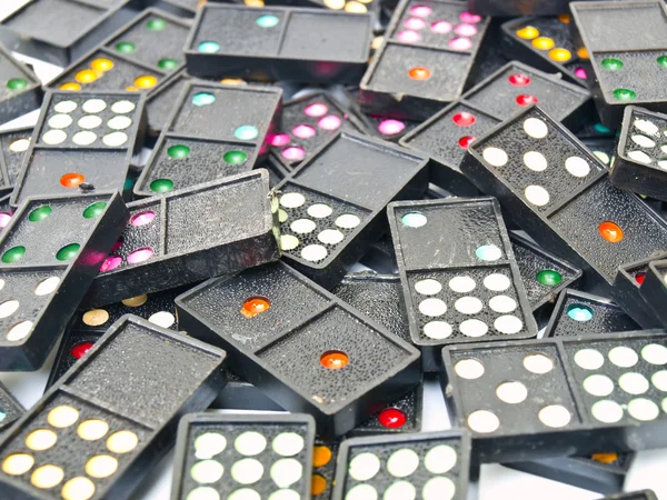 Black plastic domino isolated on white background — Stock Photo, Image