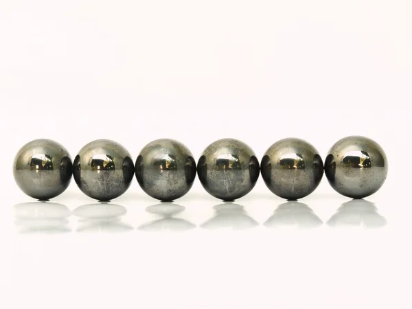 Line of iron metal balls isolated on white background — Stock Photo, Image