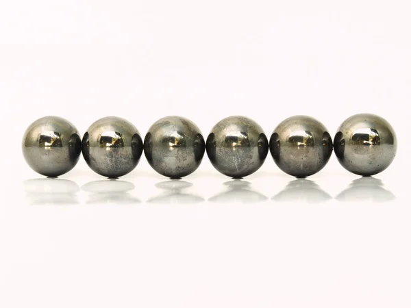 Line of iron metal balls isolated on white background — Stock Photo, Image