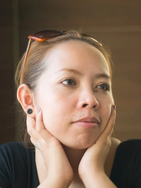 Curious young Asian lady looking on something in nature — Stock Photo, Image