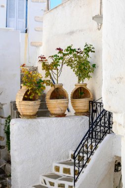 Street decorated with pots in Lefkes village on Paros Island, Cyclades, Greece clipart