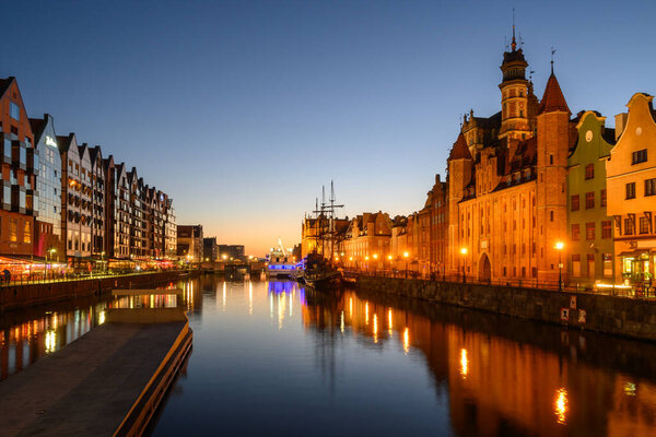 Motlawa River and beautiful old architecture of Gdansk at night. Poland