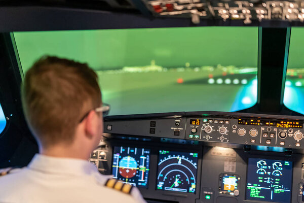 Gdansk, Poland - December 06, 2020: Interior of modern flight simulator for the training of the pilots.