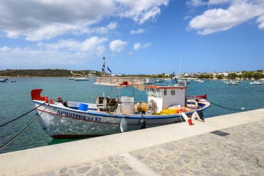Paros, Greece - September 27, 2020: Fishing boat in Aliki harbor. Aliki is beautiful coastal village with a picturesque port on Paros Island. Cyclades, Greece