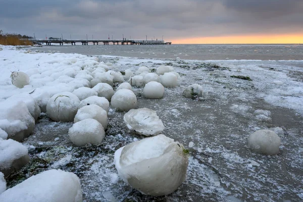 Natural ice balls on the beach in Jastarnia during winter. Hel Peninsula, Poland