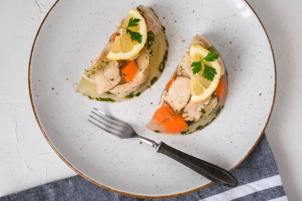 Fish in aspic with vegetables. Fish in jelly. Fish with gelatin.