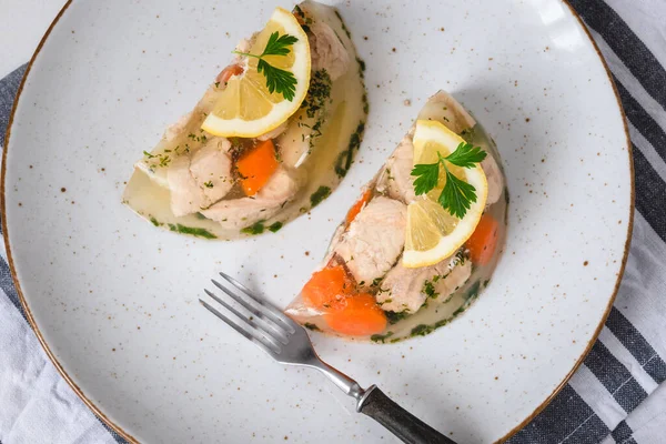 Fish in aspic with vegetables. Fish in jelly. Fish with gelatin.