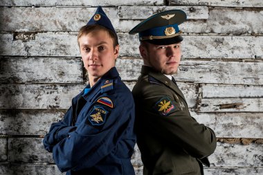 Two young men standing in military uniform clipart