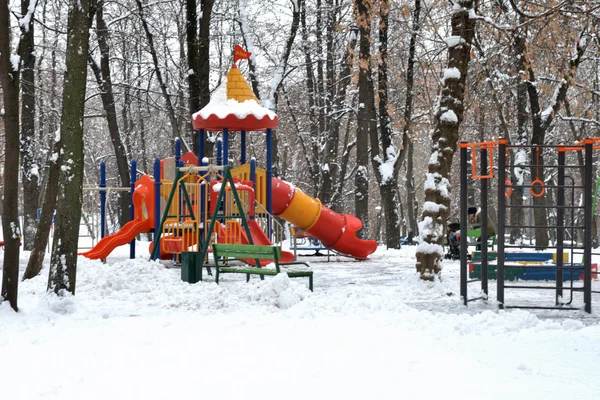 Children's playground in winter park Stock Photo