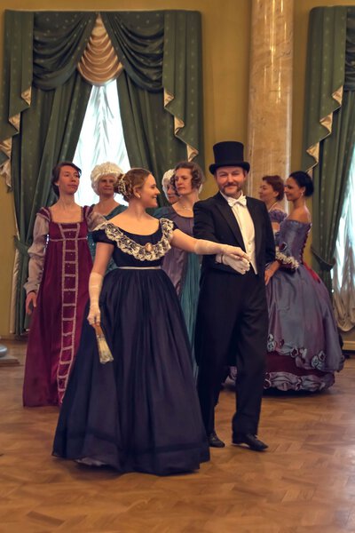 Young couple dancing the waltz in the ballroom