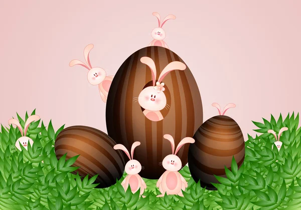 Rabbits with chocolate Easter eggs — Stock Photo, Image
