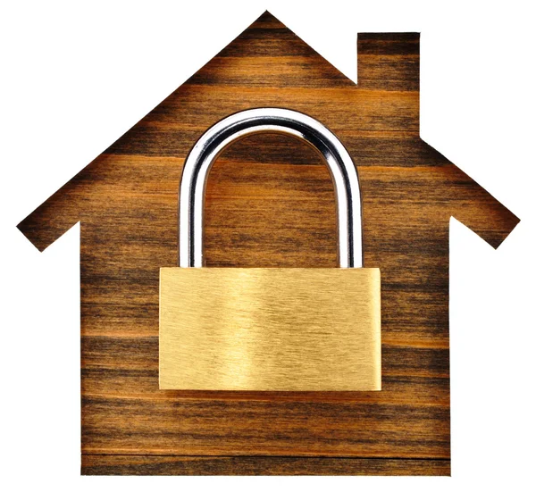 House shaped paper cutout and padlock on wood lumber. — Stock Photo, Image