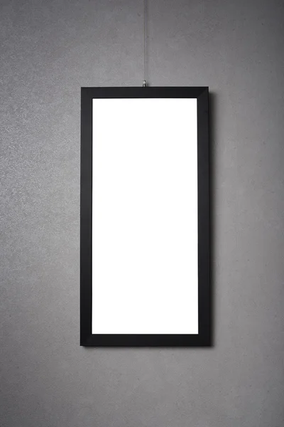 Blank black frame on a dark wall — Stock Photo, Image