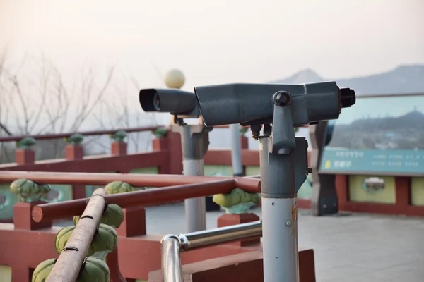 Tourist binoculars at octagonal pavilion of Bugak Skyway in Seou — Stock Photo, Image