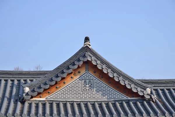 tiled roofs of Gyeongbokgung with clear sky in Seoul, Korea