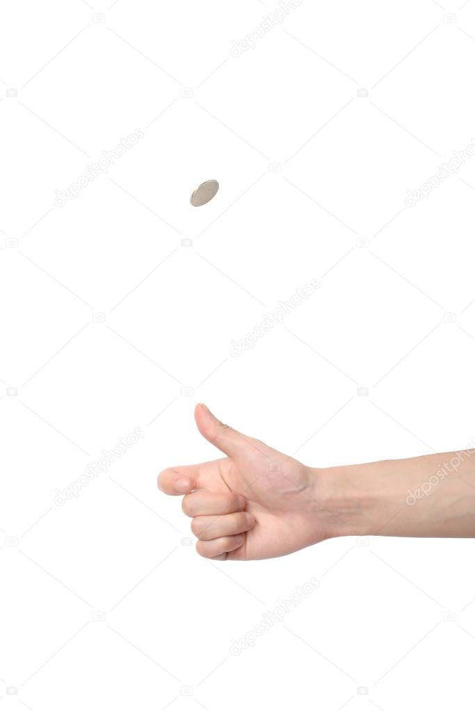 hand tossing a coin