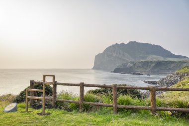 Landscape of Seongsan Ilchulbong with Olle course symbol