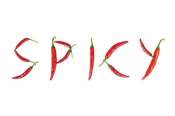 Texten "Spicy" i röd chilipeppar — Stockfoto