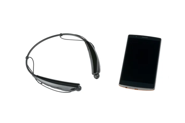 Smartphone und Bluetooth drahtloser Kopfhörer — Stockfoto