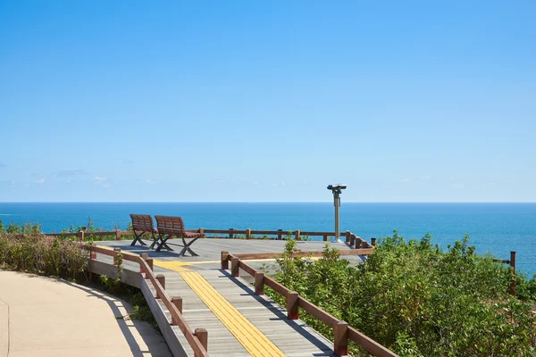 Two benches and binoculars — Stockfoto