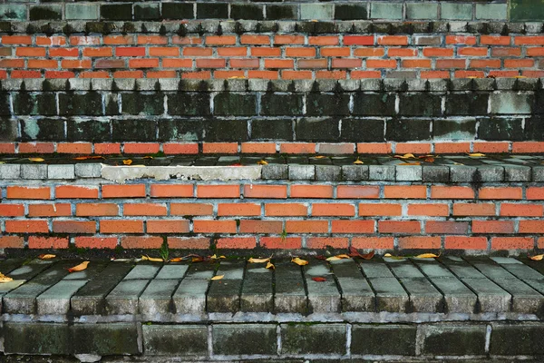 Closeup of uneven old two tone brick stairs — Stock Photo, Image