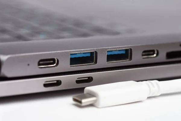 Close-up photo of laptop type-c port, type-c hub and type-c cable. Without persone