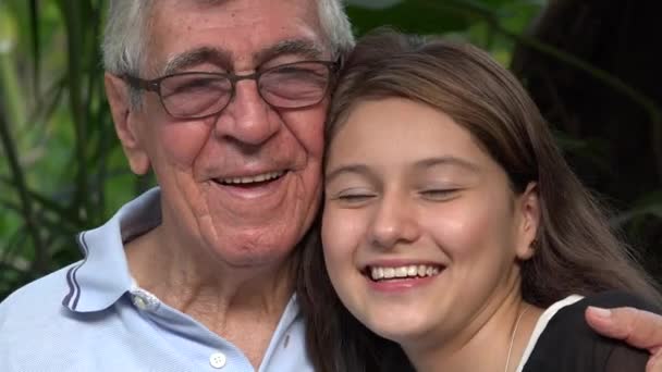 Grandfather And Teen Girl Smiling — Stock Video