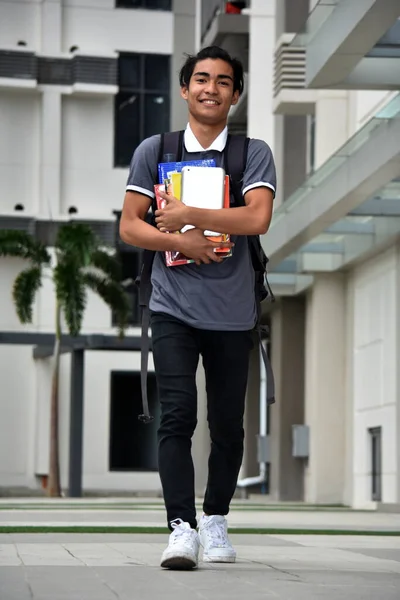 Smiling Young Minority Male Student Walking On Campus