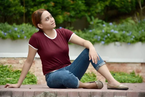 Pretty Minority Female Daydreaming Wearing Tshirt Seitting — Stock fotografie