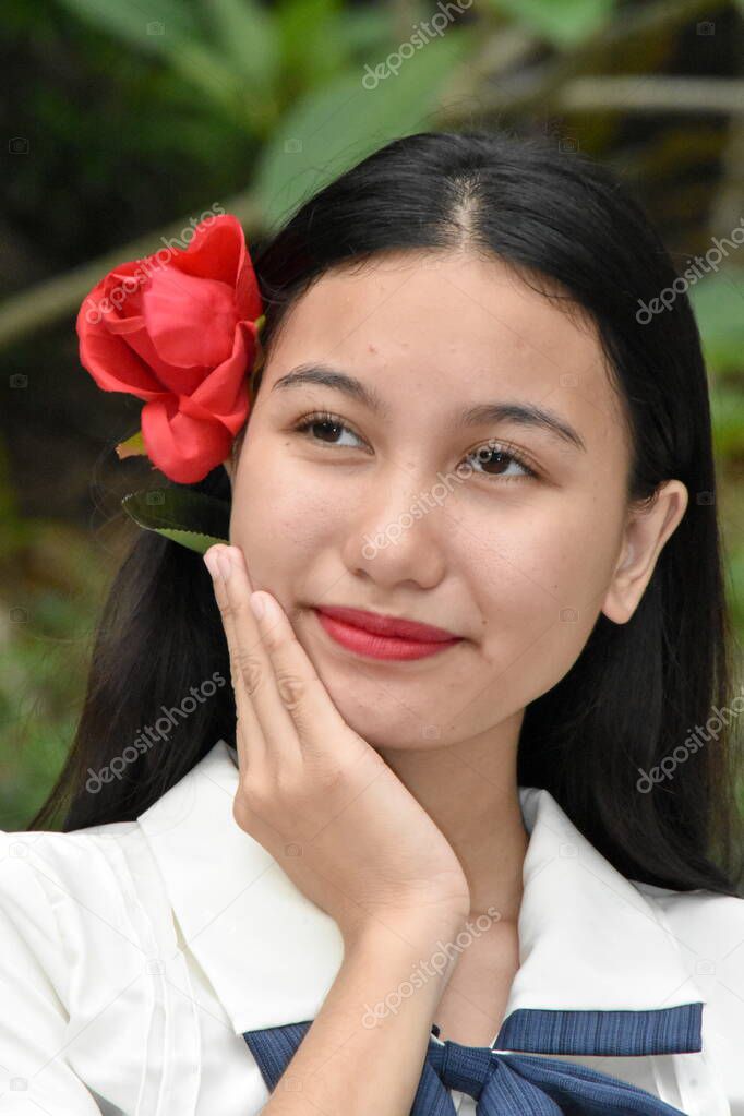 Unemotional Young Asian Female Red Flower