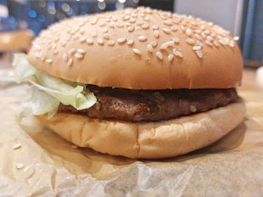 A Hamburger Patty Bun And Lettuce