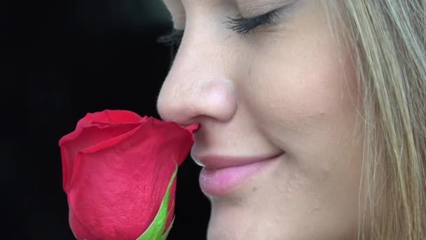 Woman Smelling Flowers — Stock Video