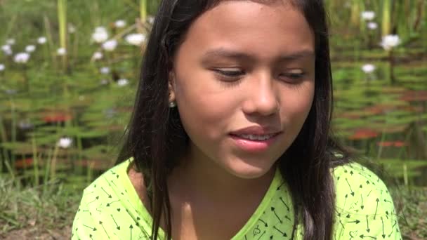 Young Girl Daydreaming near Pond — Stock Video