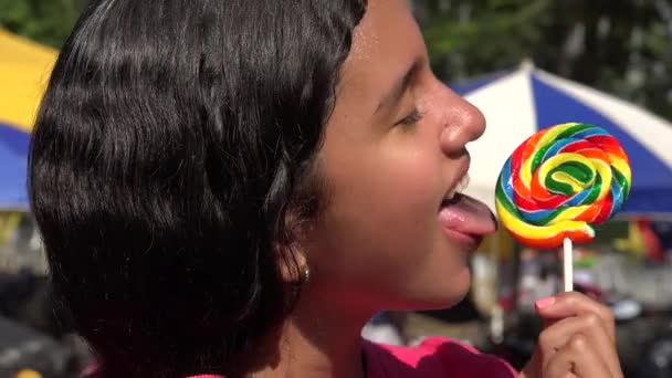 Teen Girl Eating Lollipop Candy — Stock Video © dtiberio #94572996