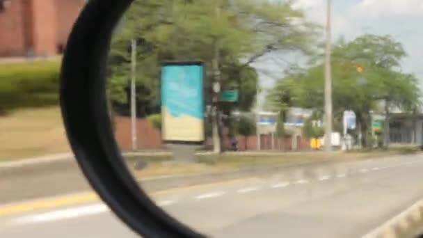 November 27 2014 - Cali, Colombia - Trees In Car Mirror — Stock Video