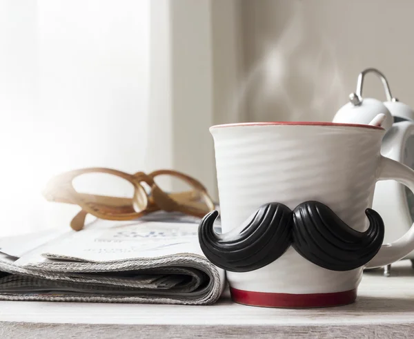 Cup with mustache on wooden table for fathers day concept — Stock Photo, Image